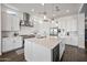 Bright, stylish kitchen with a large center island, stainless steel appliances, and modern pendant lighting at 22372 E Duncan St, Queen Creek, AZ 85142