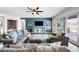 Inviting living room with plush seating, modern ceiling fan, and access to the outdoor living space at 22372 E Duncan St, Queen Creek, AZ 85142