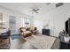 Comfortable living room featuring a ceiling fan and a stylish area rug at 22372 E Duncan St, Queen Creek, AZ 85142