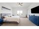 Bright main bedroom showcasing a ceiling fan, large window, and contemporary furnishings at 22372 E Duncan St, Queen Creek, AZ 85142