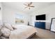 Stylish main bedroom with a TV, comfortable bed, and lots of natural light at 22372 E Duncan St, Queen Creek, AZ 85142