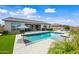 Beautiful backyard pool with lounge area and lush landscaping, perfect for relaxation and entertaining at 22372 E Duncan St, Queen Creek, AZ 85142
