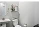 Stylish powder room with a pedestal sink and charming decor at 22372 E Duncan St, Queen Creek, AZ 85142