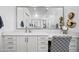 Bathroom vanity featuring a large mirror, white cabinets, and stylish decor at 22372 E Duncan St, Queen Creek, AZ 85142