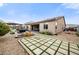 Stunning backyard featuring a charming patio, lush landscaping, and a relaxing outdoor seating area at 2336 W Magdalena Ln, Phoenix, AZ 85041