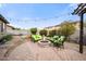 Inviting backyard with a cozy fire pit and comfortable seating, ideal for outdoor gatherings at 2336 W Magdalena Ln, Phoenix, AZ 85041