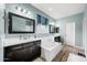 Bright bathroom featuring dual sinks, vanity space and a soaking tub at 2336 W Magdalena Ln, Phoenix, AZ 85041