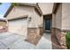 This home features a 2-car garage and attractive stone accents near the home's front entryway at 2336 W Magdalena Ln, Phoenix, AZ 85041