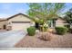 Charming single-story home featuring a well-maintained desert-scape front yard and two-car garage at 2336 W Magdalena Ln, Phoenix, AZ 85041