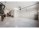 Spacious garage featuring epoxy floors and ample storage space, perfect for vehicles and hobbies at 2336 W Magdalena Ln, Phoenix, AZ 85041