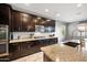 Gourmet kitchen featuring granite countertops, stainless steel appliances, and ample cabinet space at 2336 W Magdalena Ln, Phoenix, AZ 85041