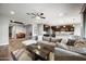 Spacious living room with an open floor plan and a view of the well-appointed kitchen at 2336 W Magdalena Ln, Phoenix, AZ 85041
