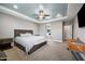 Large main bedroom featuring recessed lights, carpet, a ceiling fan and a connected bathroom at 2336 W Magdalena Ln, Phoenix, AZ 85041