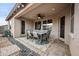 Covered patio with a ceiling fan and outdoor dining set, perfect for al fresco meals at 2336 W Magdalena Ln, Phoenix, AZ 85041