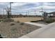Community basketball court with well-maintained surface and modern lighting for evening games at 23781 N 162Nd Ave, Surprise, AZ 85387