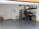 Spacious garage with ample storage space and access door to the interior at 240 W Juniper Ave # 1053, Gilbert, AZ 85233