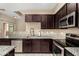 Kitchen featuring stainless steel appliances and granite countertops with lots of storage at 240 W Juniper Ave # 1053, Gilbert, AZ 85233
