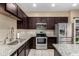 Modern kitchen featuring stainless steel appliances and granite countertops at 240 W Juniper Ave # 1053, Gilbert, AZ 85233