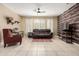 Cozy living room with stylish furniture, wood paneling, and neutral tones, perfect for relaxing at 240 W Juniper Ave # 1053, Gilbert, AZ 85233