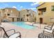 A well-maintained community pool area surrounded by attractive residences at 240 W Juniper Ave # 1053, Gilbert, AZ 85233