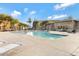 Comfortable community pool area with sun loungers and surrounding greenery at 240 W Juniper Ave # 1053, Gilbert, AZ 85233