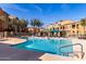 Beautiful community pool with lounge chairs, cabana and vibrant landscaping at 240 W Juniper Ave # 1053, Gilbert, AZ 85233