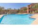 Community pool with clear blue water and lounge chairs provides a great place to relax at 240 W Juniper Ave # 1053, Gilbert, AZ 85233