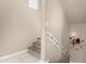 A staircase with modern wooden stairs and a white handrail at 240 W Juniper Ave # 1053, Gilbert, AZ 85233