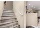 Wood-look staircase leading to the upper level of the home at 240 W Juniper Ave # 1053, Gilbert, AZ 85233