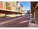 Street view of townhomes featuring attached garages and well-maintained exteriors at 240 W Juniper Ave # 1053, Gilbert, AZ 85233
