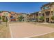 Exterior view of the community volleyball court adjacent to the residential buildings at 240 W Juniper Ave # 1053, Gilbert, AZ 85233