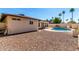 Great backyard with refreshing swimming pool, beautiful patio, and desert landscaping at 2416 S Evergreen Rd, Tempe, AZ 85282