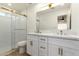 Bright bathroom featuring double sinks, stylish fixtures, and a glass-enclosed shower at 2416 S Evergreen Rd, Tempe, AZ 85282