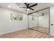 Bedroom features a window offering natural light and mirrored closet doors at 2416 S Evergreen Rd, Tempe, AZ 85282