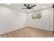 Cozy bedroom featuring wood-look flooring and a ceiling fan at 2416 S Evergreen Rd, Tempe, AZ 85282