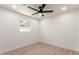 Bedroom with sleek ceiling fan, window, and neutral walls at 2416 S Evergreen Rd, Tempe, AZ 85282