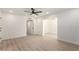 Spacious bright bedroom with large window, ceiling fan and views into other rooms at 2416 S Evergreen Rd, Tempe, AZ 85282