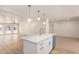 Open floorplan kitchen island with quartz counters, stainless steel sink and dishwasher at 2416 S Evergreen Rd, Tempe, AZ 85282