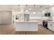 Stylish kitchen with white cabinets, quartz countertops, and stainless steel appliances at 2416 S Evergreen Rd, Tempe, AZ 85282