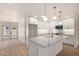 Stylish kitchen with white cabinets, quartz countertops, and stainless steel appliances at 2416 S Evergreen Rd, Tempe, AZ 85282
