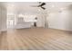 Open-concept living space with modern floors flowing into a sleek, bright kitchen at 2416 S Evergreen Rd, Tempe, AZ 85282