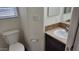 Well-lit bathroom featuring a modern vanity with a light countertop and wood cabinetry at 2460 E Main St # F7, Mesa, AZ 85213