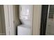 Convenient laundry area with a stacked washer and dryer set, optimizing space and functionality at 2460 E Main St # F7, Mesa, AZ 85213