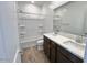 Bathroom featuring double sinks, modern fixtures, and a shower-tub combo at 25215 W Wayland Dr, Buckeye, AZ 85326