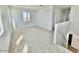 Upstairs bonus room featuring carpeted floors and neutral walls at 25215 W Wayland Dr, Buckeye, AZ 85326