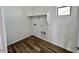 Dedicated laundry room featuring laminate floors and lots of light at 25215 W Wayland Dr, Buckeye, AZ 85326