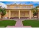 This home has a covered back patio with tile flooring, exterior fans, access doors, and views of the yard at 25425 N 64Th Ave, Phoenix, AZ 85083