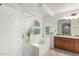 Primary bathroom boasts a soaking tub, walk-in shower and double sink vanity at 25425 N 64Th Ave, Phoenix, AZ 85083