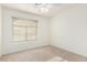 Bedroom features natural light from window with blinds and neutral carpet at 25425 N 64Th Ave, Phoenix, AZ 85083