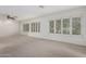 Large bright bedroom with carpet, ceiling fan and natural light at 25425 N 64Th Ave, Phoenix, AZ 85083